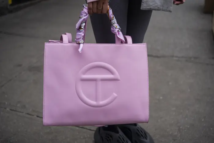 A close up of a pink shopping bag.